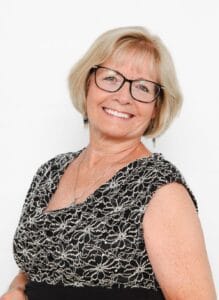 Lori Gradley smiling in formal dress, professional life coach photo